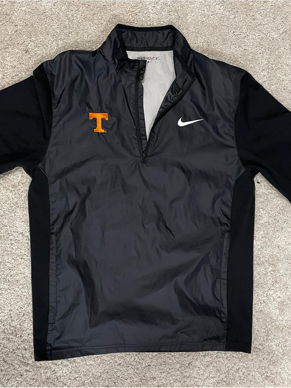 Nike Black Pullover Jacket with Orange 'T' and White Swoosh